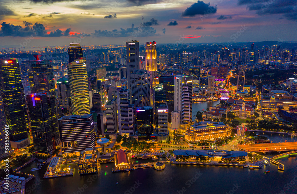 Aerial view of the Singapore landmark financial business district at sunset scene with skyscraper and beautiful sky. Singapore downtown Aerial view of the Singapore landmark financial business district at sunset scene with skyscraper and beautiful sky. Singapore downtown
