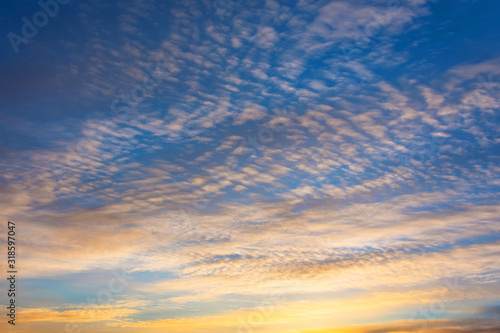 View of tall clouds in the troposphere in the evening at sunset. © aapsky