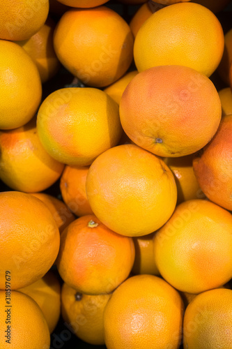 grapefruit on a store counter. Texture on background
