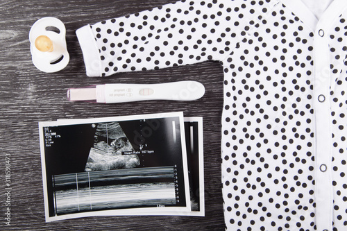 Pregnancy test and ultrasound photo  photo