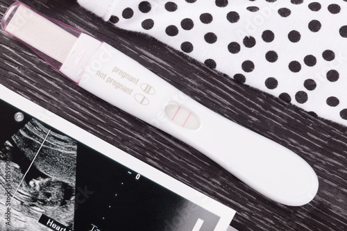 Positive pregnancy test and ultrasound  photo