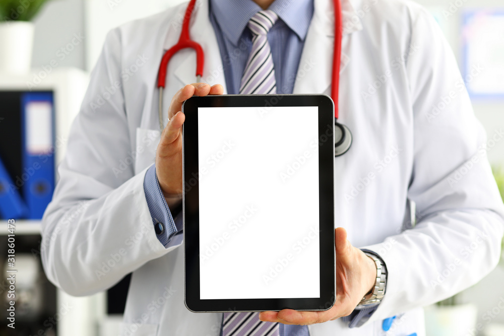 Male doctor holding digital tablet pc Male doctor holding digital tablet pc