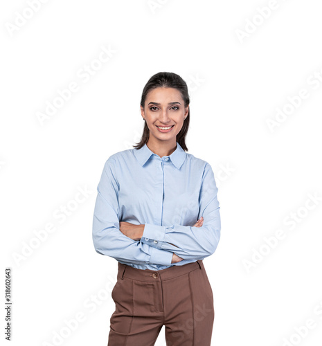 Smiling young businesswoman with crossed arms