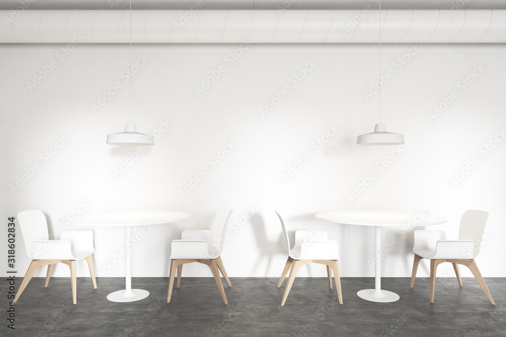 Tables in stylish white industrial style cafe Tables in stylish white industrial style cafe