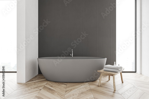 Gray and white bathroom with tub