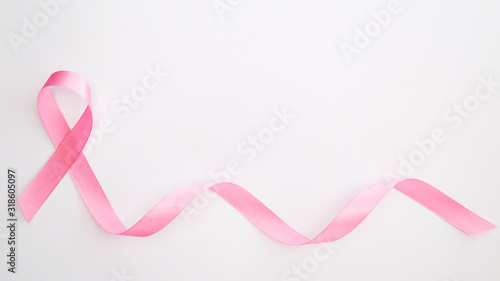 Pink ribbon on white background