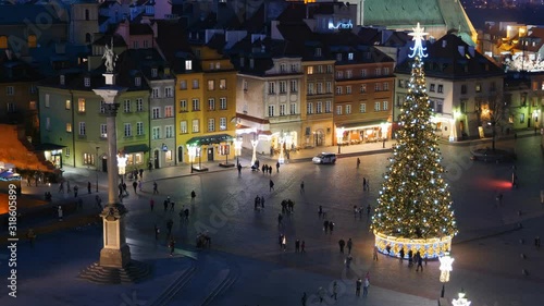 City of Warsaw in Poland at night, Old Town, King Sigismund Column and illuminated Christmas tree on the Castle Square