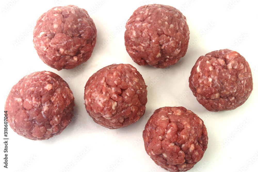 closeup fresh raw meatballs beef isolated over white background closeup fresh raw meatballs beef isolated over white background