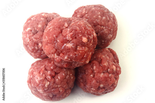closeup fresh raw meatballs beef isolated over white background