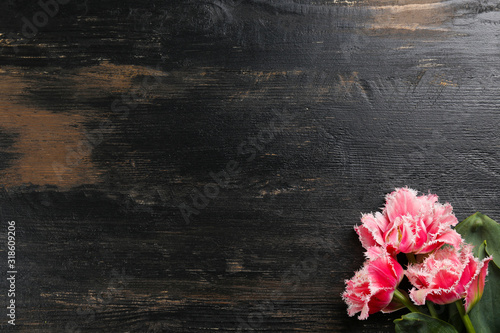 Valokuva Bunch of spring flowers on textured table backgound with a lot of copy space for text