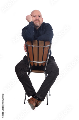 bald man sitting on white background photo