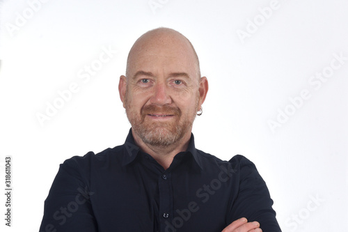 portrait of bald man on white, smiling