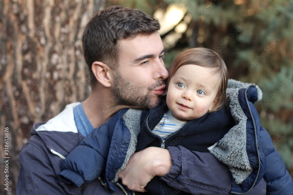 Handsome father with his one year old baby Handsome father with his one year old baby