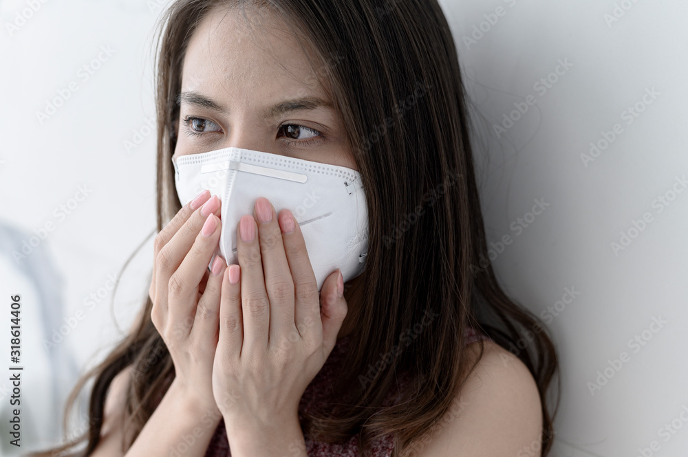 Woman wearing face mask for Prevent New coronavirus 2019-nCoV from China Woman wearing face mask for Prevent New coronavirus 2019-nCoV from China
