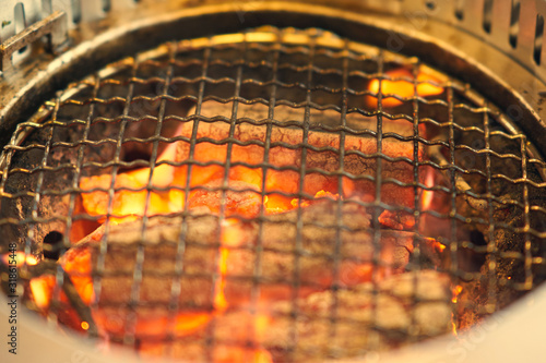 Charcoal grill with grating on fire ,closed up © vachcameraman