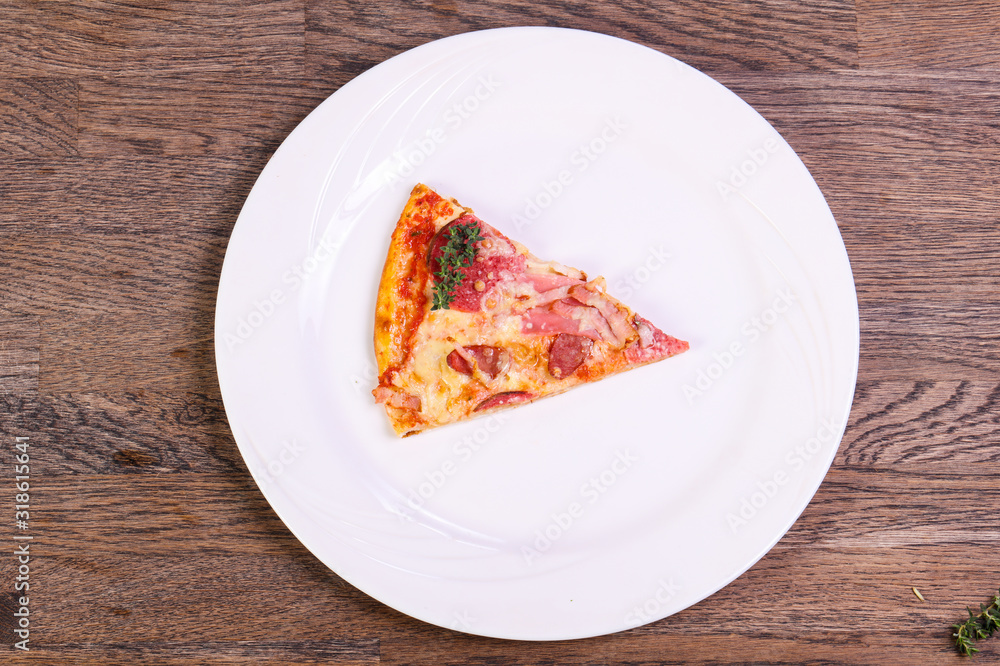 Pizza with ham and sausages Pizza with ham and sausages