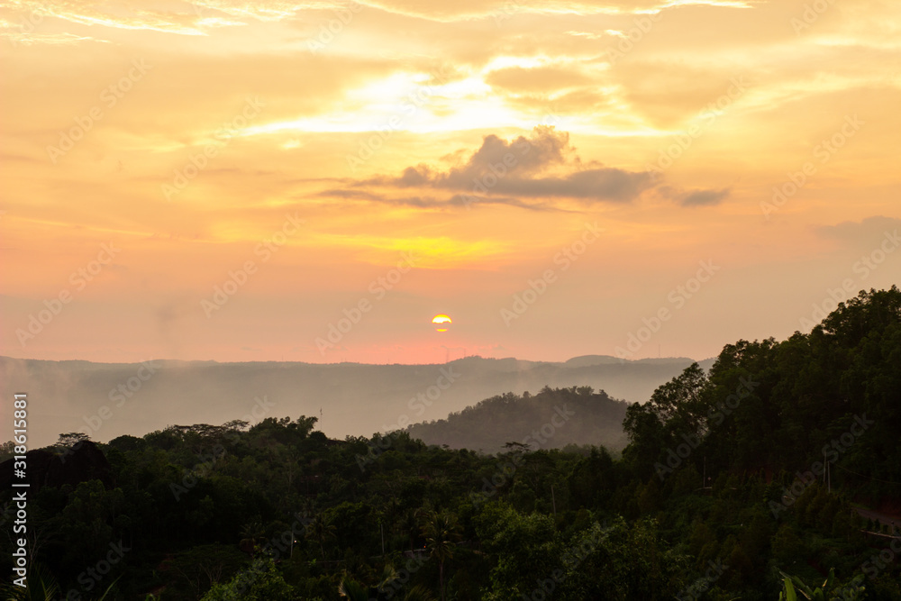 The sunset on Purba Volcano Mountain,Mount Api Purba. one of the tourist destination in Gunungkidul, Yogyakarta, Indonesia. The sunset on Purba Volcano Mountain,Mount Api Purba. one of the tourist destination in Gunungkidul, Yogyakarta, Indonesia.