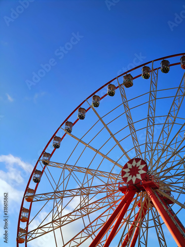 Partly visible ferris wheel at sunset