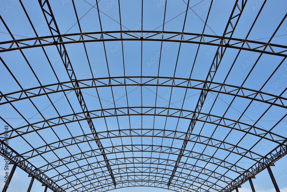 steel structure roof truss under the factory of building at construction site with blue sky steel structure roof truss under the factory of building at construction site with blue sky