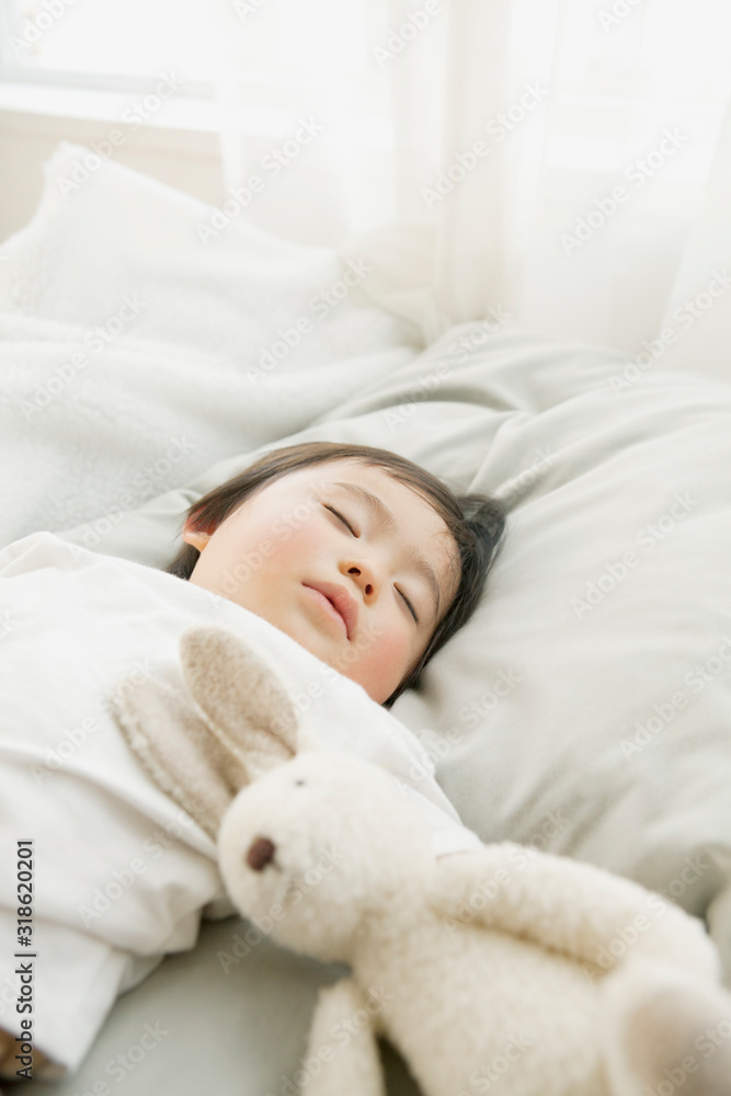 Toddler boy sleeping with toy rabbit Toddler boy sleeping with toy rabbit