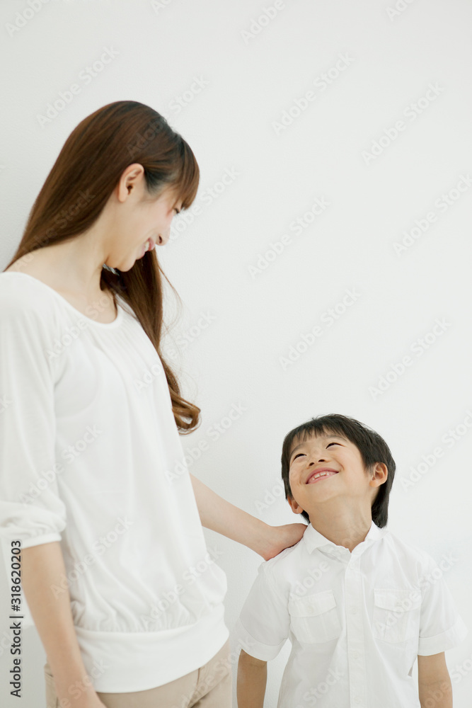 Mother and son looking at each other and smiling Mother and son looking at each other and smiling