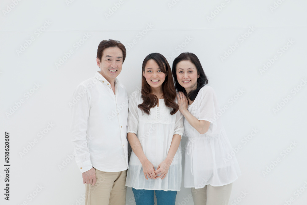 Studio portrait of parents with adult daughter Studio portrait of parents with adult daughter