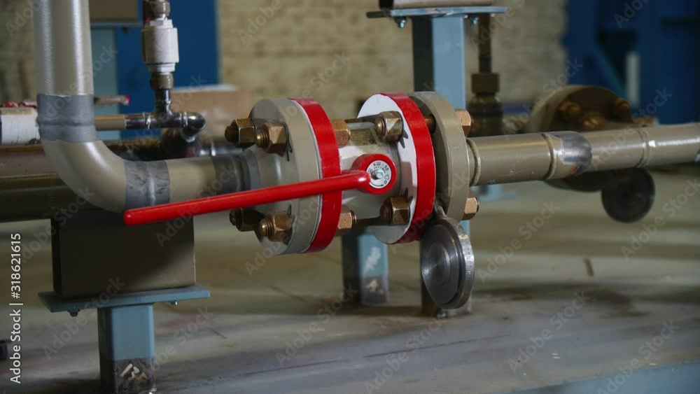 white brown pipes with red level at gas compression station white brown pipes with red level at gas compression station
