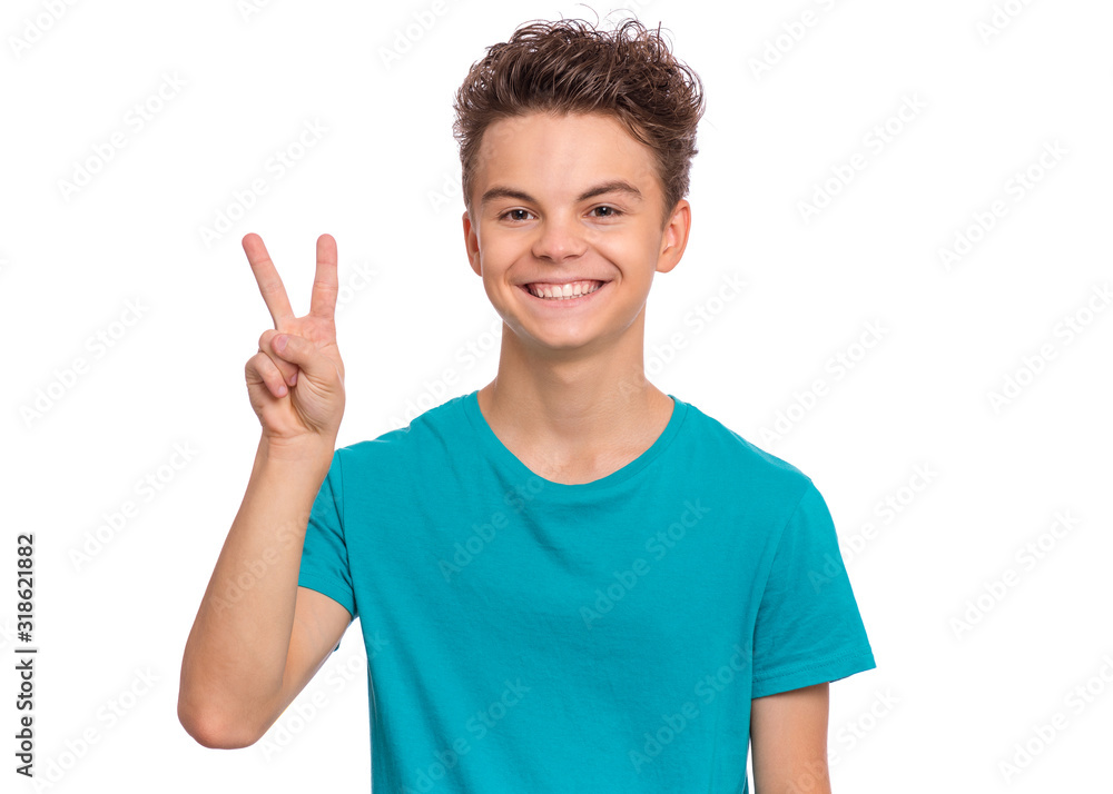 Portrait of happy teen boy showing one palm - 2 fingers, isolated on white background. Happy smiling child doing gesture of number Two. Series of photos count from 1 to 10. Portrait of happy teen boy showing one palm - 2 fingers, isolated on white background. Happy smiling child doing gesture of number Two. Series of photos count from 1 to 10.