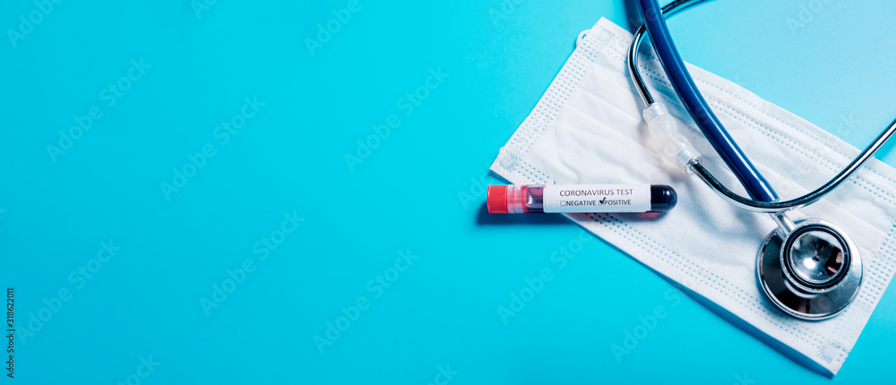 2019-nCoV  in Wuhan, China. virus Coronavirus blood test in Laboratory Coronavirus test list medical form, test blood tubes stethoscope on blue copy space background for a banner. - obrazy, fototapety, plakaty 