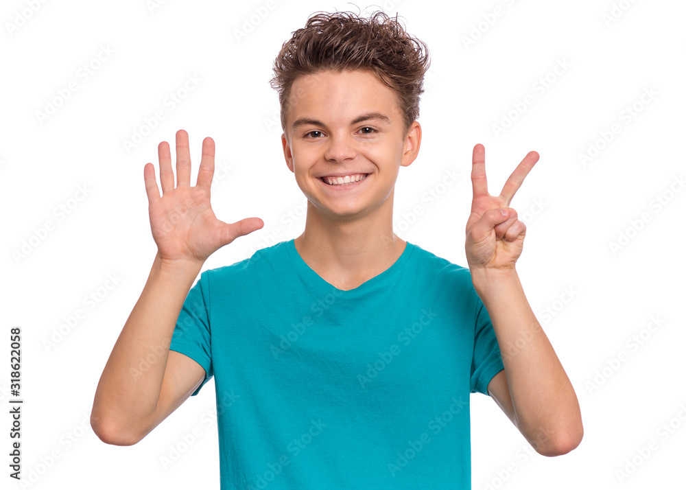 Portrait of happy teen boy showing two palms - 7 fingers, isolated on white background. Happy smiling child doing gesture of number Seven. Series of photos count from 1 to 10. Portrait of happy teen boy showing two palms - 7 fingers, isolated on white background. Happy smiling child doing gesture of number Seven. Series of photos count from 1 to 10.