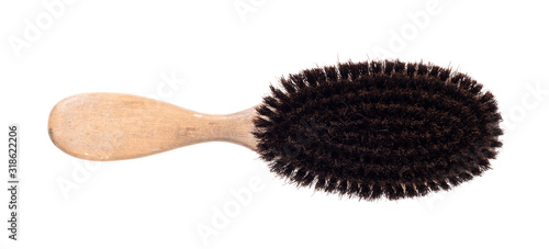 Old hair brush with some hair in it