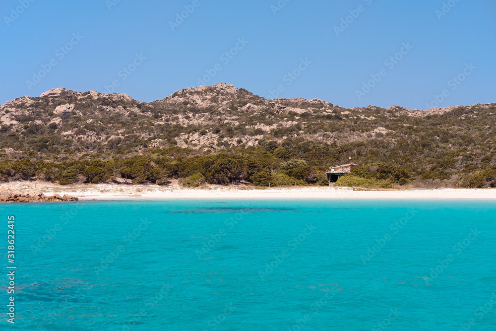 Spiaggia Rosa, Budelli, the pink sand beach of Sardinia with forbidden access, taken from a boat on a warm summer day