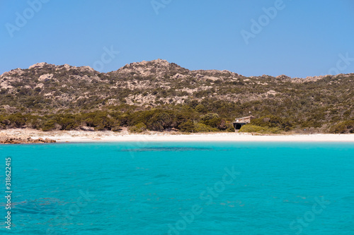 Fototapeta Naklejka Na Ścianę i Meble -  Spiaggia Rosa, Budelli, the pink sand beach of Sardinia with forbidden access, taken from a boat on a warm summer day