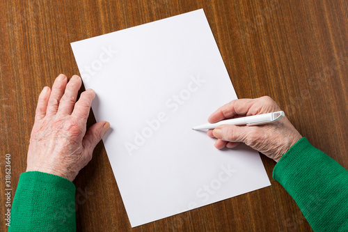Old hands with blank paper