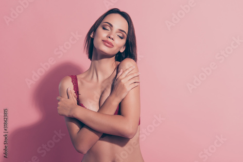 Close-up portrait of her she nice sweet lovely adorable winsome attractive charming naughty hot lady girlfriend wife erotica leisure touching herself isolated over pink pastel background photo