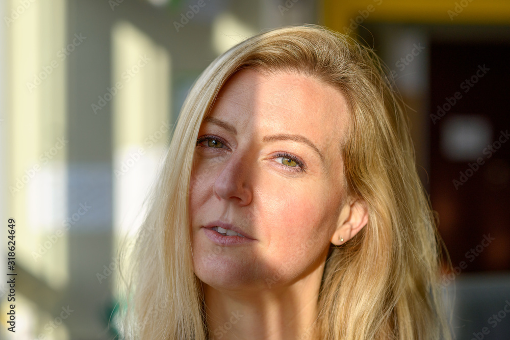 Sceptical woman looking suspiciously at camera Sceptical woman looking suspiciously at camera