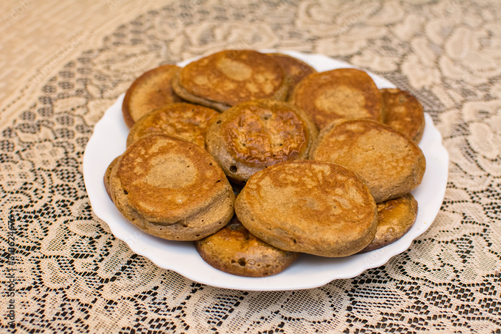Chickpea flour pancakes lie on a white plate