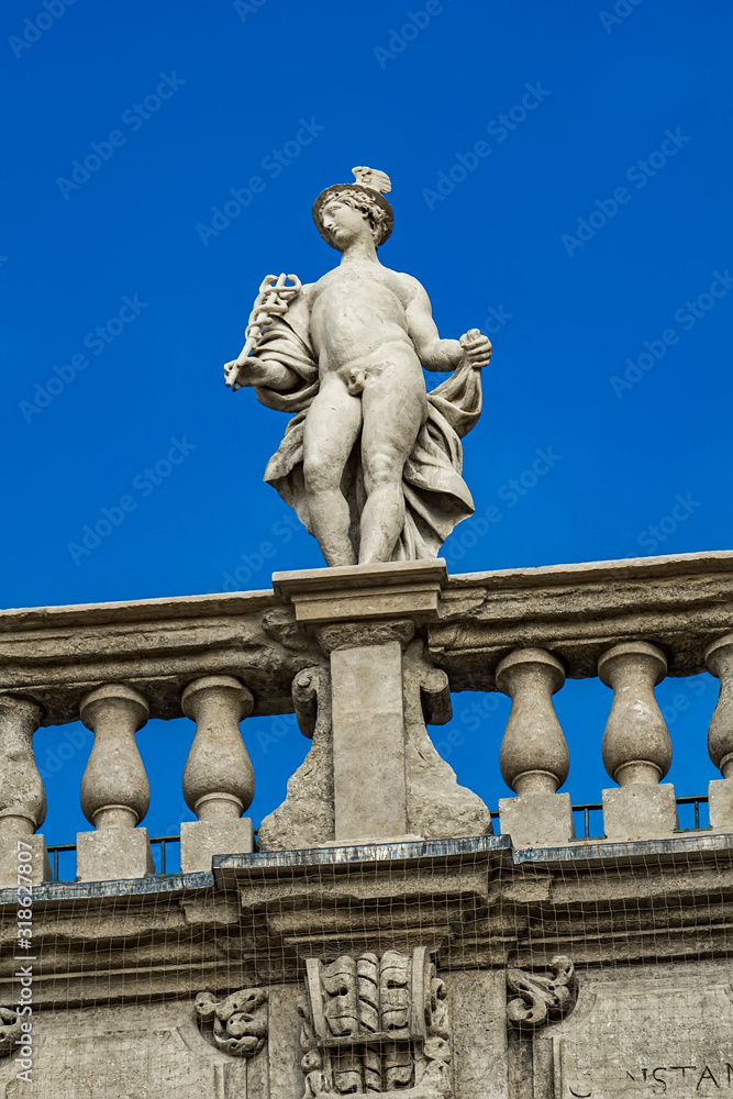 Palazzo Maffei with statue of divinitiy at Piazza delle Erbe in Verona, Italy
