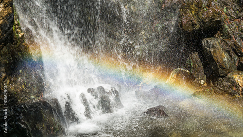 Beautiful rainbow above the waterfall in forest. Mountains of troodos, Cyprus