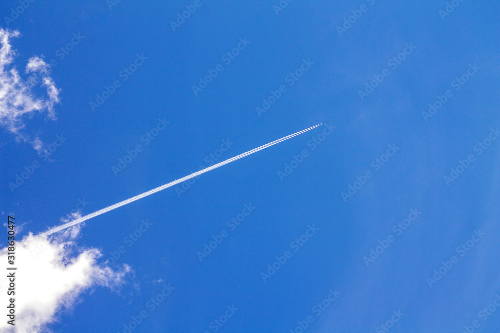 Trail from an airplane in a clear sky