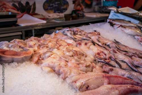 Fresh seafood on ice at the fish market. Stack of fresh different fish served on crushed ice. Seafood fresh background. Italy. Venice. Fish Market.