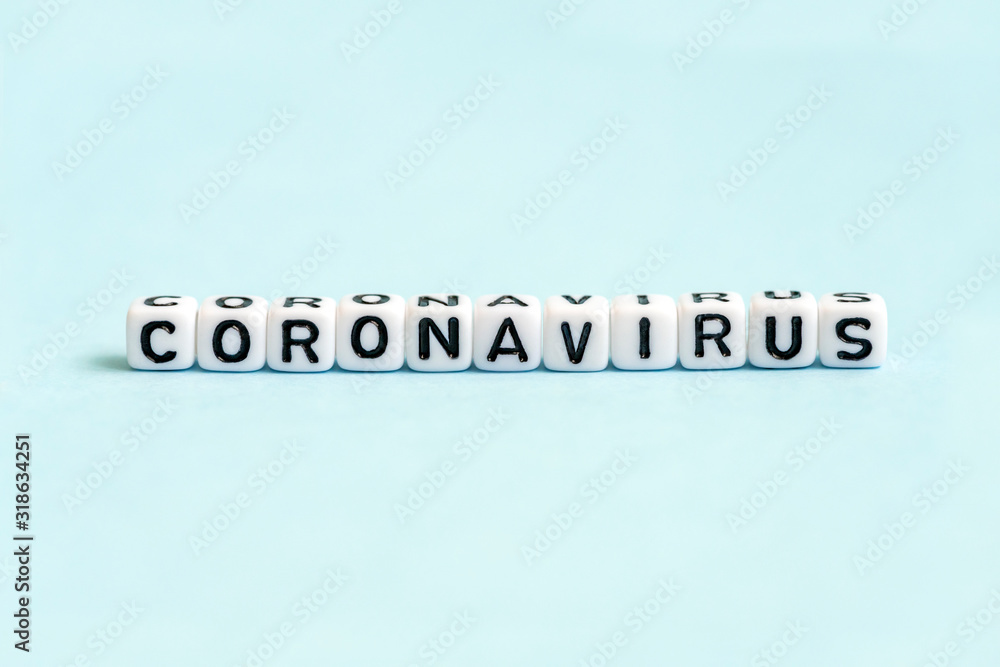 Coronavirus word written on blocks on blue background. New rapidly spreading virus from China (Wuhan). Corona virus 2019-nCoV, MERS-CoV Coronavirus word written on blocks on blue background. New rapidly spreading virus from China (Wuhan). Corona virus 2019-nCoV, MERS-CoV