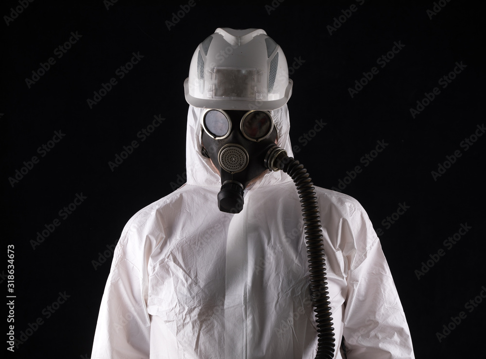 a worker in a helmet and a gas mask and a white jumpsuit a worker in a helmet and a gas mask and a white jumpsuit