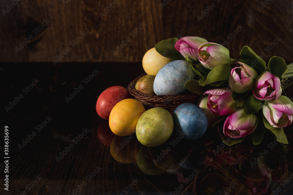 Multi-colored bright easter eggs. Easter. Easter eggs on a dark wooden background Easter background. Easter symbol Easter greetings Christ is risen Copyspace close-up Multi-colored bright easter eggs. Easter. Easter eggs on a dark wooden background Easter background. Easter symbol Easter greetings Christ is risen Copyspace close-up