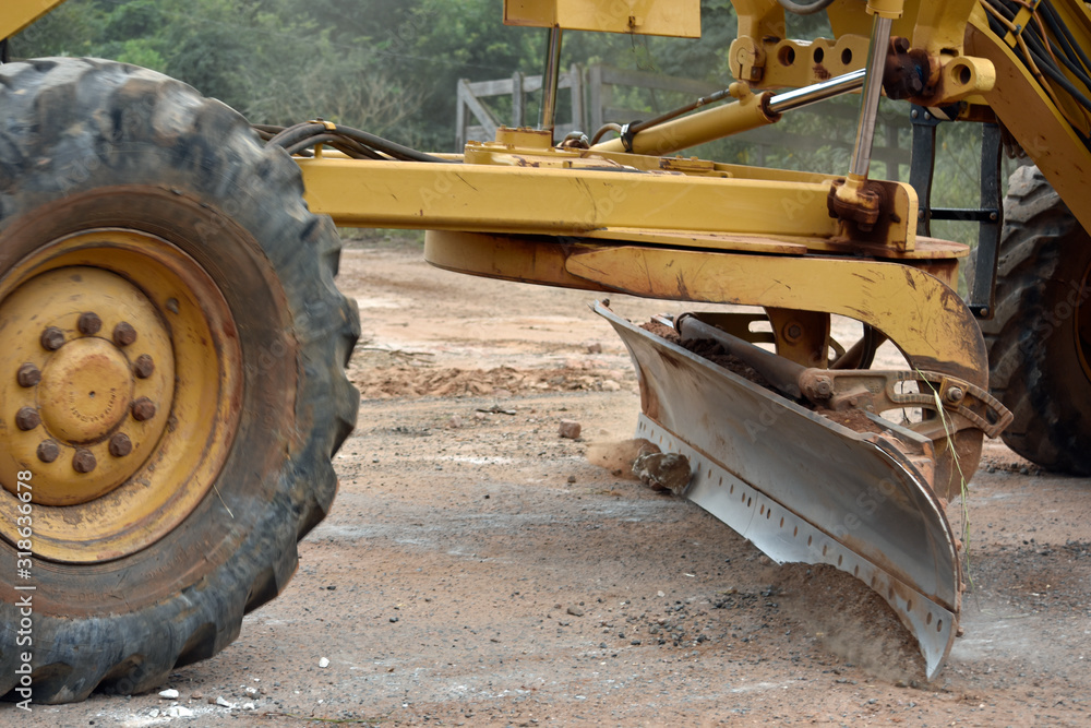 Roadworks machine in Brasil working on gravel road. Roadworks machine in Brasil working on gravel road.