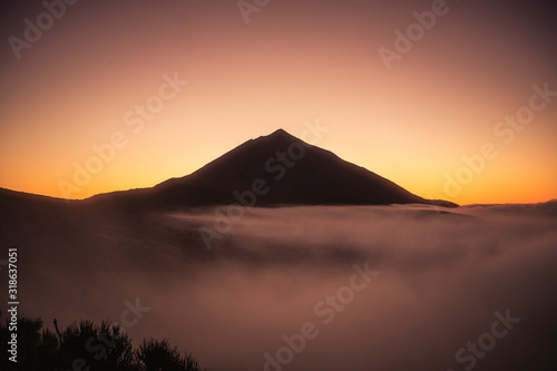 Beautiful view landscape of sunset or sunrise of el teide vulcan with clouds and foreground nature © simona