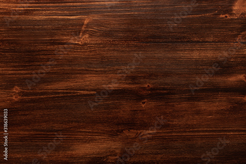 Background texture of old dark brown wood with defects