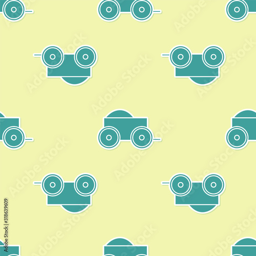 Green Wooden four-wheel cart with hay icon isolated seamless pattern on yellow background. Vector Illustration