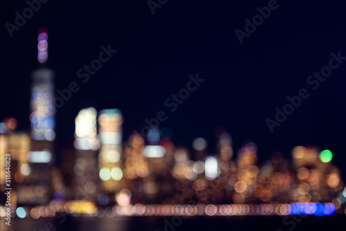 Amazing panorama view on New York City skyline and Downtown Manhattan from Jersey City during night. Defocused background image