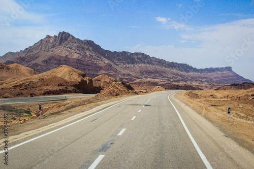 Desert landscape with rocks and geological formations on a hot summer day on the road from Kerman to Mashhad.